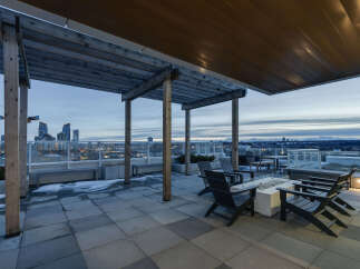 Enjoy breathtaking city views from this stunning rooftop patio.