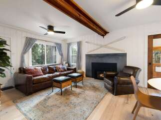 Step into a cozy living space with a rustic charm.