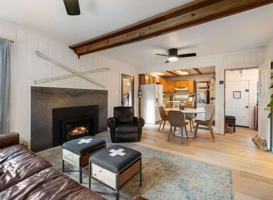 Step into a cozy living space featuring a stunning fireplace, perfect for those chilly evenings.