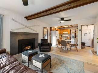 Step into a cozy living space featuring a stunning fireplace, perfect for those chilly evenings.