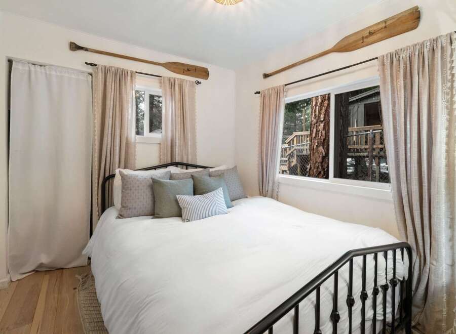This charming bedroom features a cozy bed with plush pillows, perfect for a relaxing retreat.