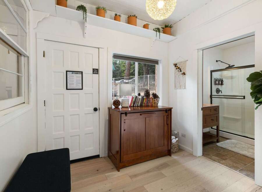 Step into this inviting space, featuring a blend of natural light and stylish design.