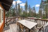 Enjoy the tranquility of this stunning property with a spacious deck perfect for outdoor dining and relaxation.