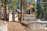 Nestled amidst towering trees, this charming cabin offers a serene escape.
