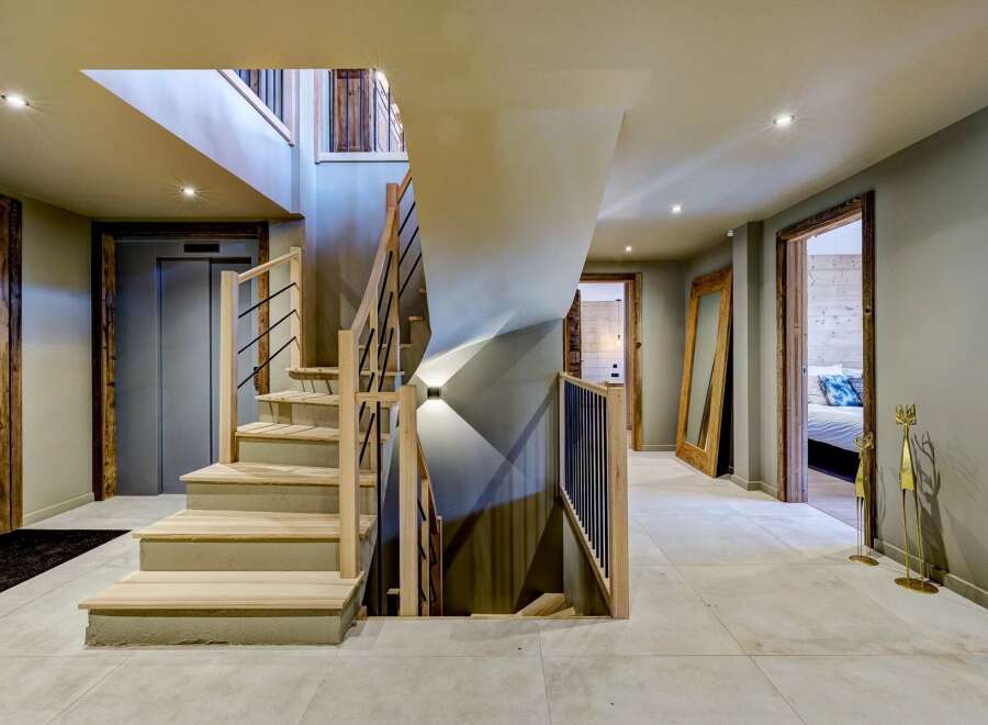 Step into luxury with this stunning property featuring a grand staircase and modern design.