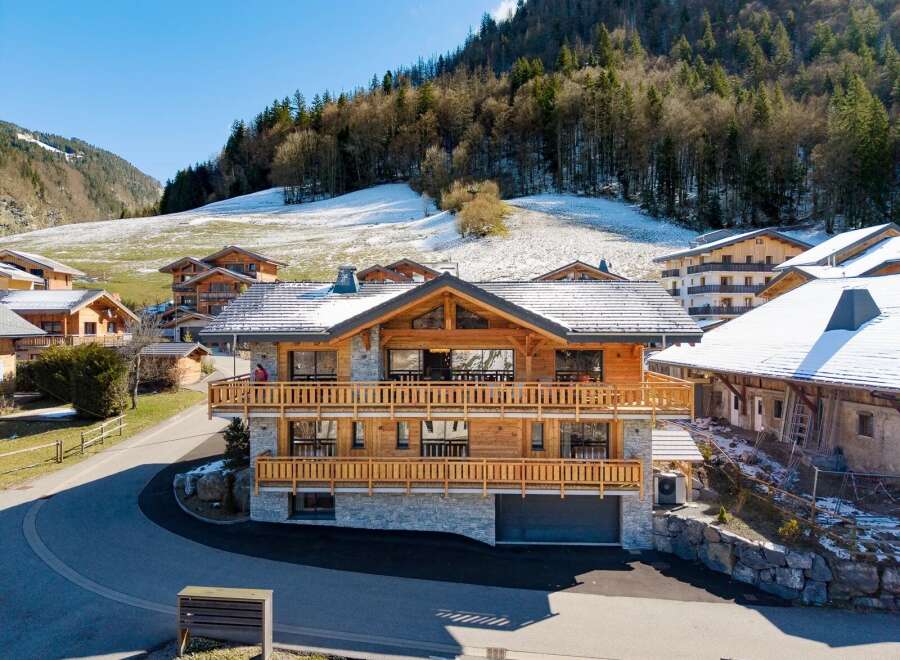 Discover the charm of this stunning wooden chalet nestled in a picturesque mountain setting.