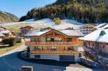 Discover the charm of this stunning wooden chalet nestled in a picturesque mountain setting.