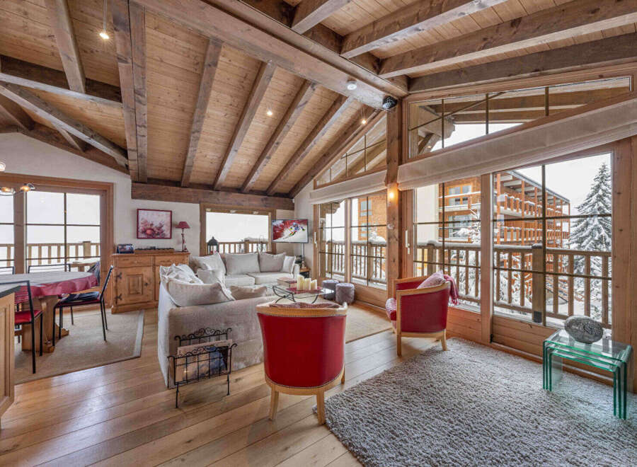 Experience the epitome of luxury living in this stunning chalet, boasting a warm and inviting interior.