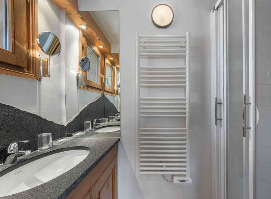 Step into luxury with this stunning bathroom featuring a sleek design and modern amenities.
