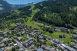 Discover the charm of this stunning mountain village, nestled amidst lush greenery and towering peaks.