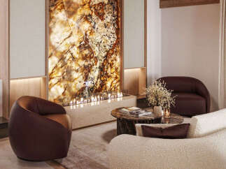 Experience luxury living in this stunning property, featuring a unique fireplace and a cozy seating area.