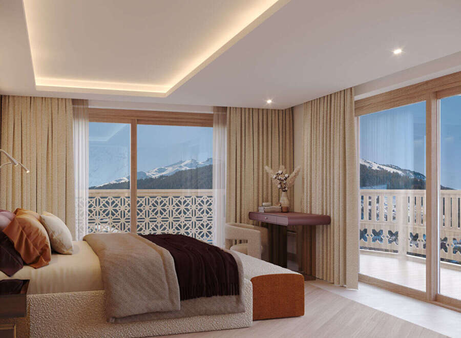 Experience luxury living with this stunning bedroom featuring breathtaking mountain views.