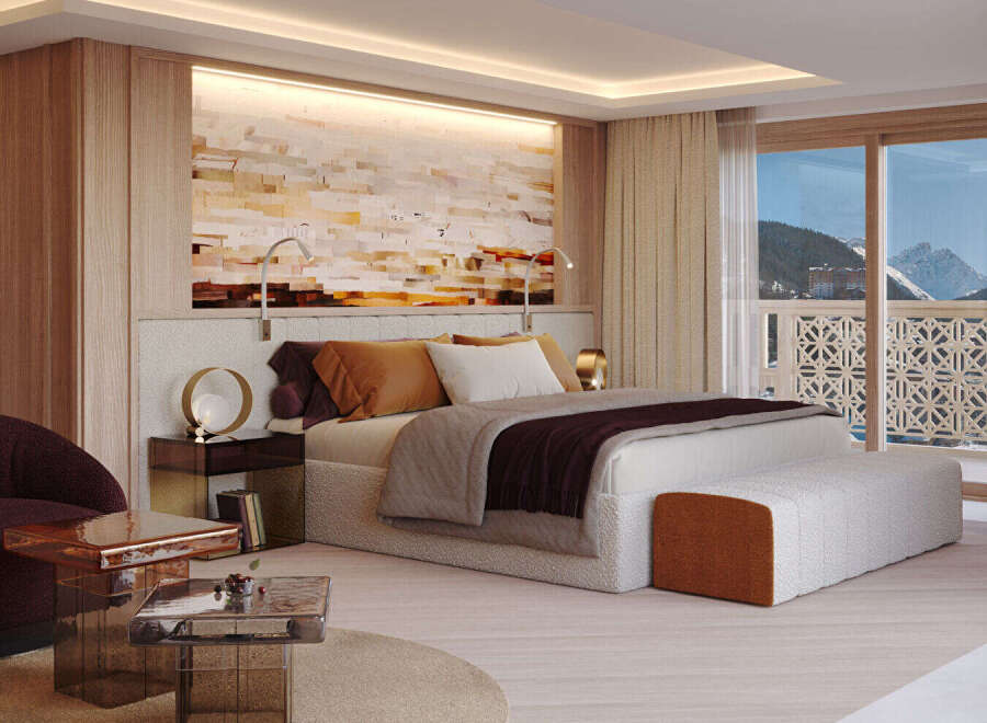 Experience luxury living in this stunning bedroom with breathtaking mountain views.