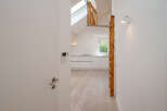 Discover this stunning property featuring a modern kitchen with sleek white cabinetry and a bright, airy atmosphere.