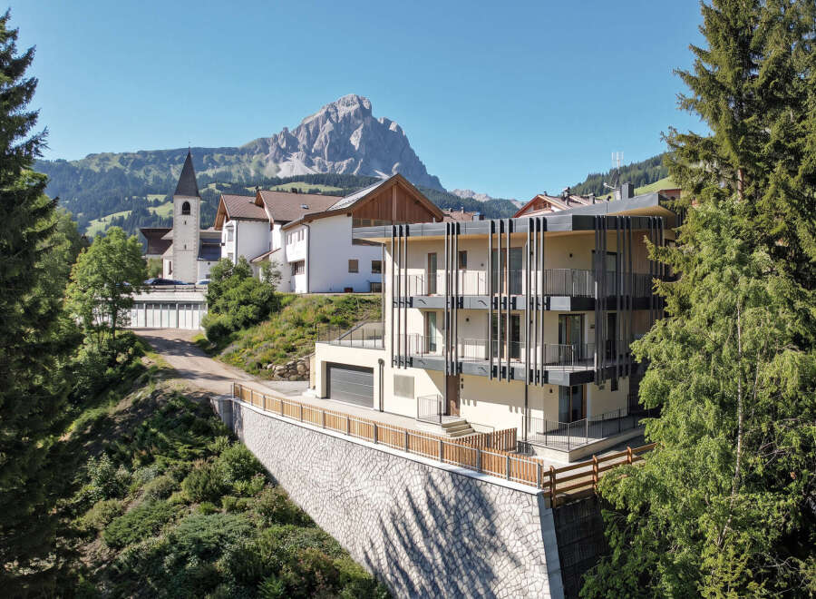 Experience modern living nestled in a picturesque mountain village, offering stunning panoramic views.