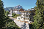 Experience modern living nestled in a picturesque mountain village, offering stunning panoramic views.