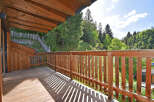 Enjoy the serene mountain views from this charming wooden balcony, perfect for morning coffee or evening relaxation.