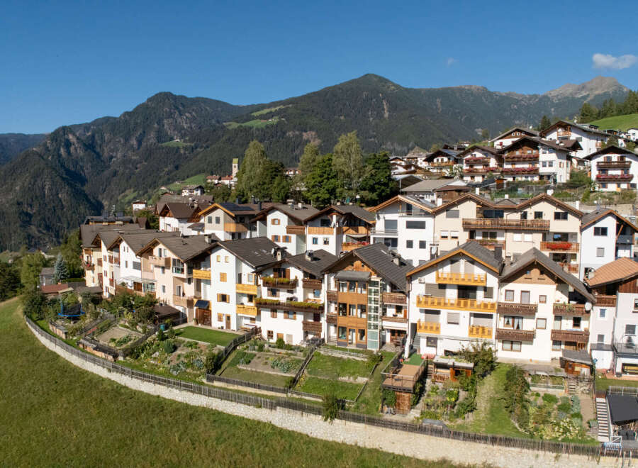 Discover charming alpine living in this picturesque village nestled amidst breathtaking mountain scenery.