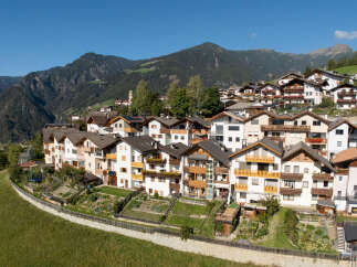Discover charming alpine living in this picturesque village nestled amidst breathtaking mountain scenery.