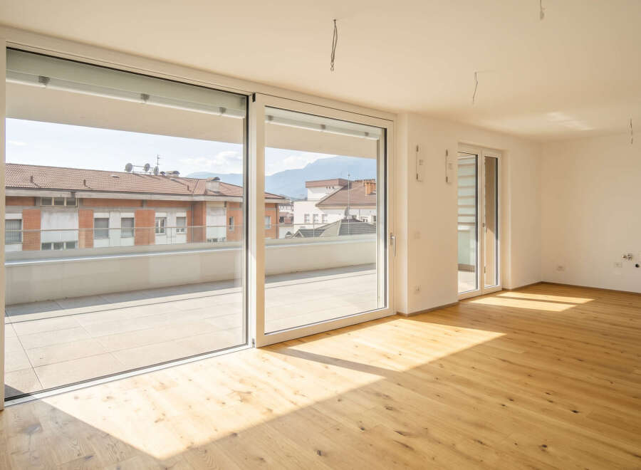 Experience modern living in this spacious apartment featuring a large balcony with city views.