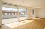 Experience modern living in this spacious apartment featuring a large balcony with city views.