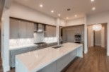 This stunning kitchen boasts a large island with a marble countertop, perfect for entertaining.