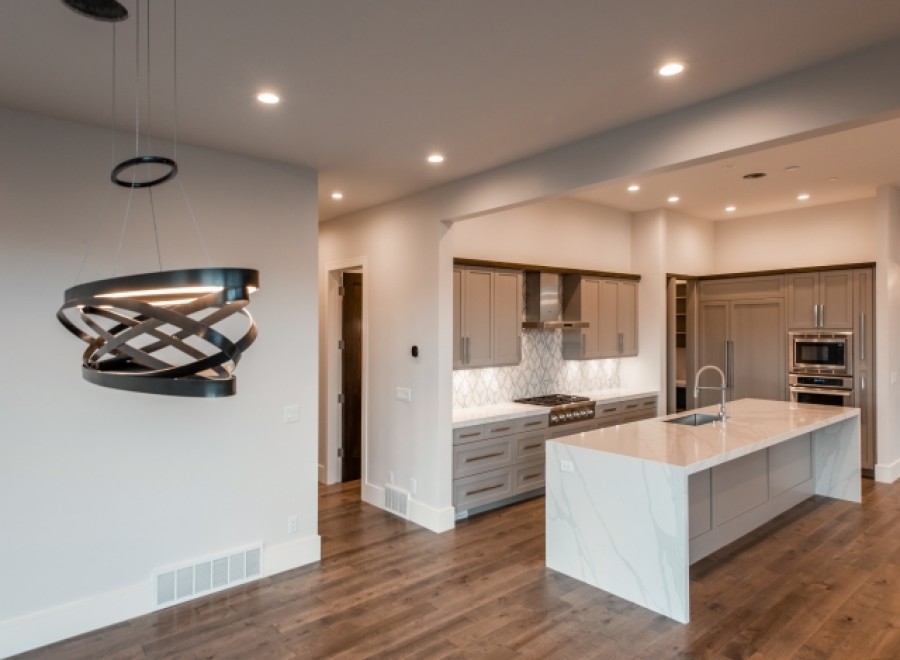 Stunning kitchen with modern pendant lighting and expansive island.
