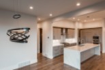 Stunning kitchen with modern pendant lighting and expansive island.
