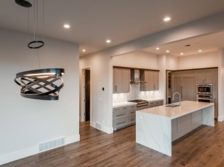 Stunning kitchen with modern pendant lighting and expansive island.