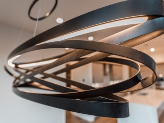 Modern pendant light fixture with sleek, dark metal design.