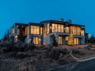 Luxury mountain home with stunning nighttime views.