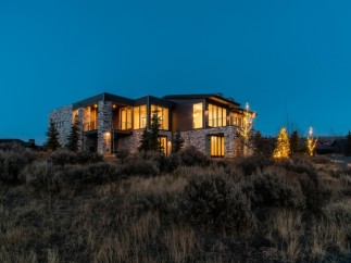 Luxury mountain home with stunning nighttime views.
