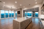 This stunning home boasts an open floor plan with breathtaking mountain views from expansive windows.