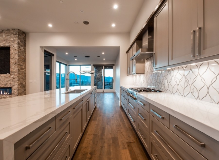 Stunning kitchen with expansive windows offering breathtaking mountain views.
