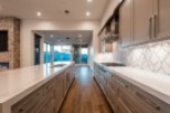 Stunning kitchen with expansive windows offering breathtaking mountain views.