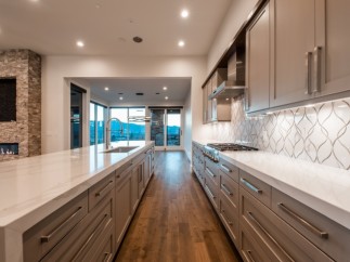 Stunning kitchen with expansive windows offering breathtaking mountain views.