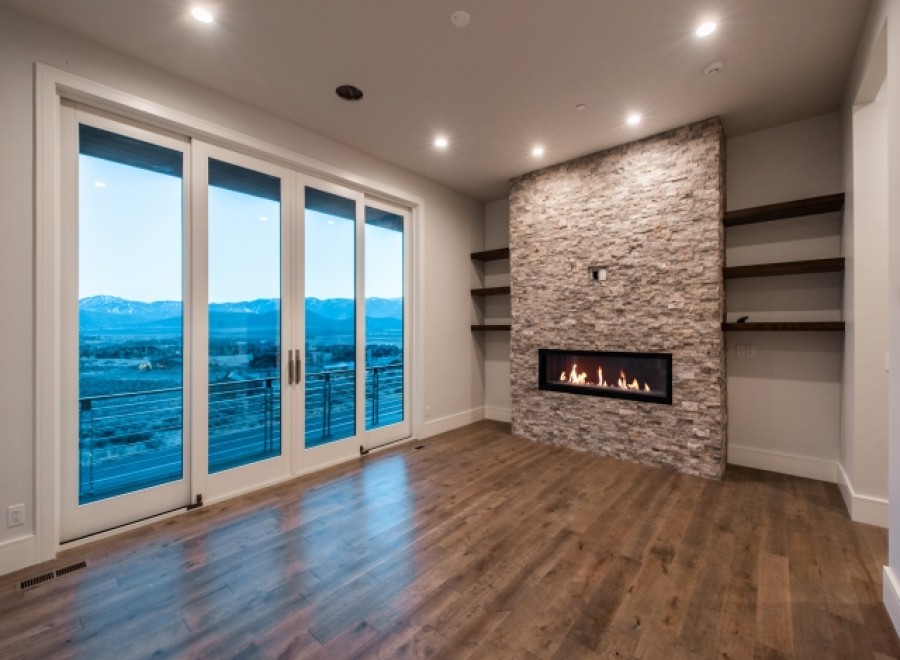 This stunning property boasts breathtaking views through expansive sliding glass doors, offering a seamless transition between indoor and outdoor living.