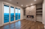 This stunning property boasts breathtaking views through expansive sliding glass doors, offering a seamless transition between indoor and outdoor living.