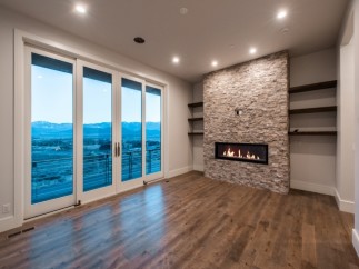 This stunning property boasts breathtaking views through expansive sliding glass doors, offering a seamless transition between indoor and outdoor living.