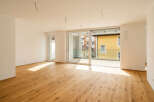 Experience modern living in this bright and airy apartment featuring a spacious open-plan living area with beautiful hardwood floors.