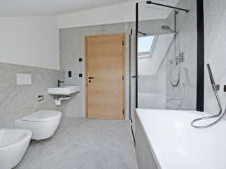 This modern bathroom boasts a sleek design with a focus on functionality and style.