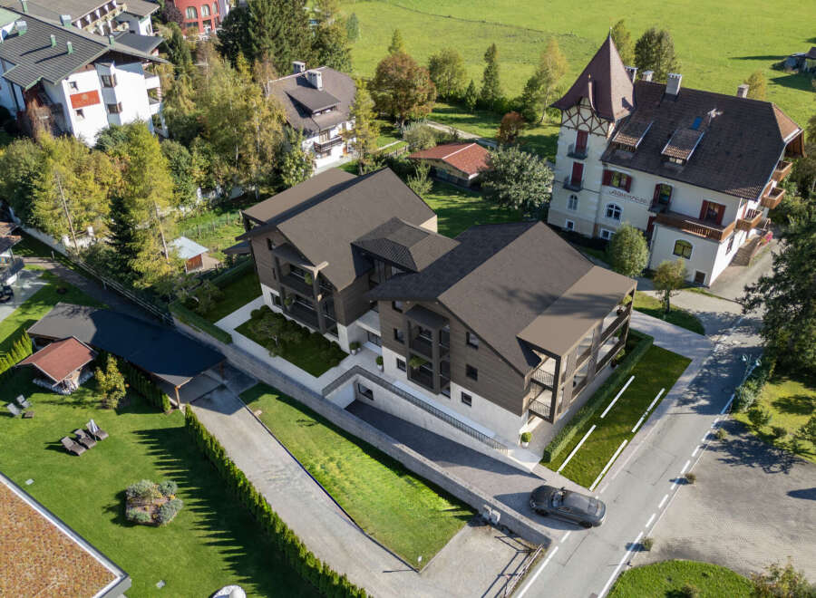 Discover modern living in this stunning new development, featuring sleek architecture and spacious balconies perfect for enjoying the alpine views.