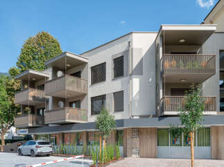 Discover modern living in this stunning apartment building featuring spacious balconies with scenic views and contemporary architecture.