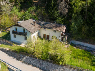 Nestled in a serene, wooded area, this charming house offers a perfect blend of tranquility and comfort.