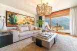 Experience luxury living in this stunning property, featuring a spacious living room with breathtaking mountain views.