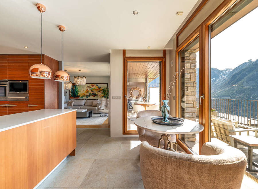 Experience luxury living in this stunning property, featuring a modern kitchen with sleek countertops and high-end appliances.