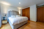 This stunning bedroom boasts a luxurious and inviting atmosphere, perfect for relaxation.