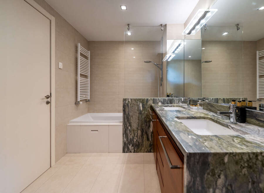 Step into luxury with this stunning bathroom featuring a sleek design and high-end finishes.