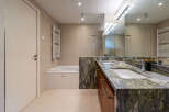 Step into luxury with this stunning bathroom featuring a sleek design and high-end finishes.