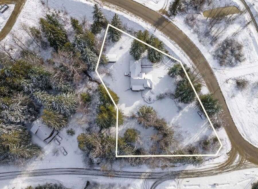 Nestled amidst a winter wonderland, this property offers a serene escape.